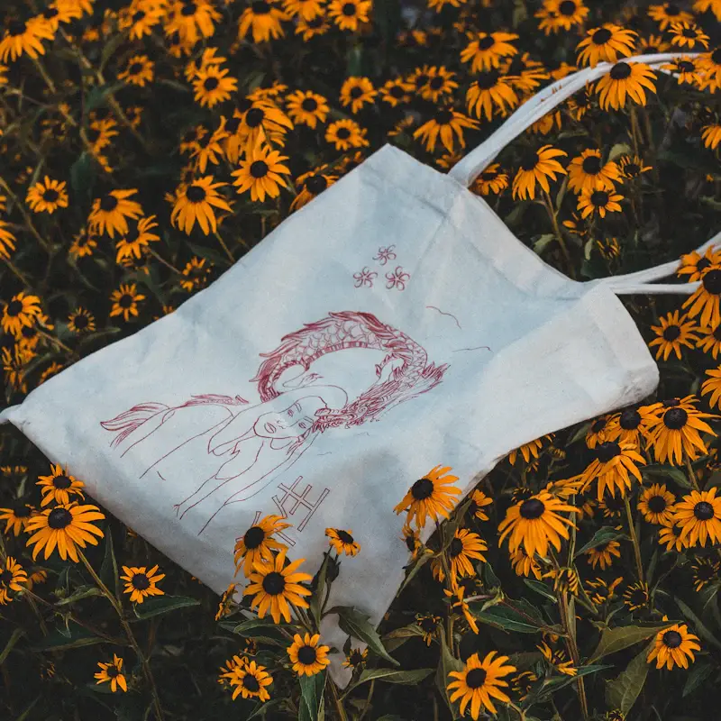 Embroidered tote bag with stitched embroidery artwork