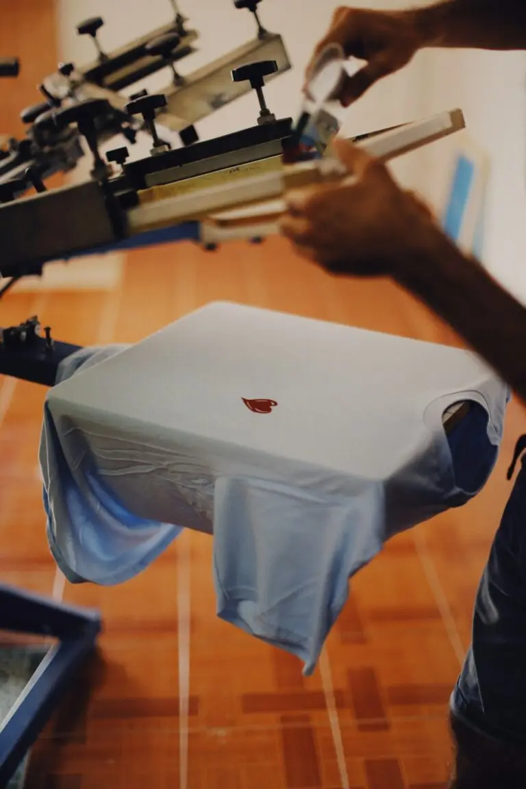 Heat press applying a DTF transfer to a t-shirt