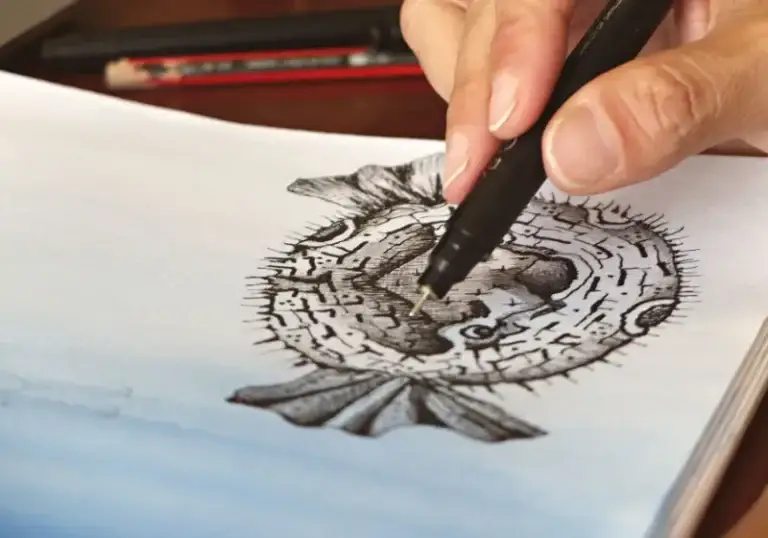 Artist inking a detailed line art illustration for vectorization