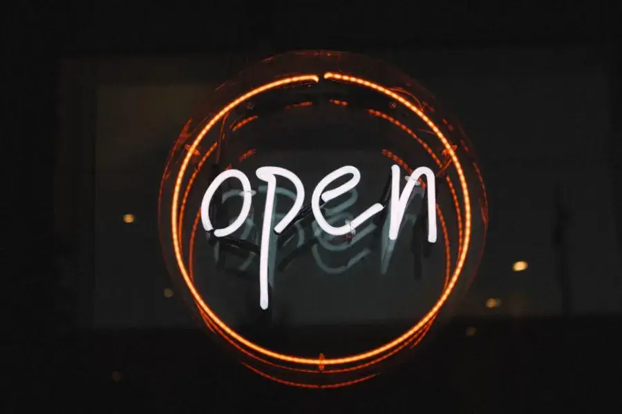 Neon storefront sign made from a vector logo