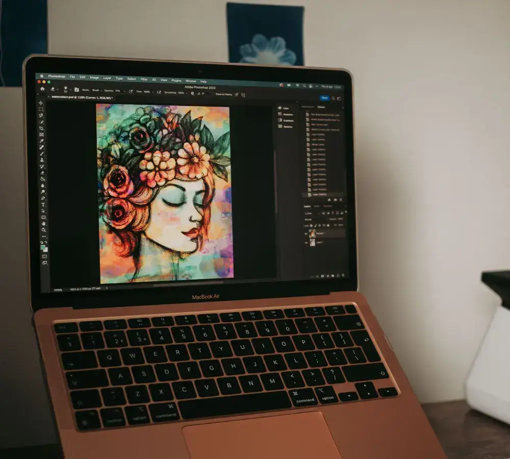 Custom vector artwork being created in Adobe Illustrator on a laptop